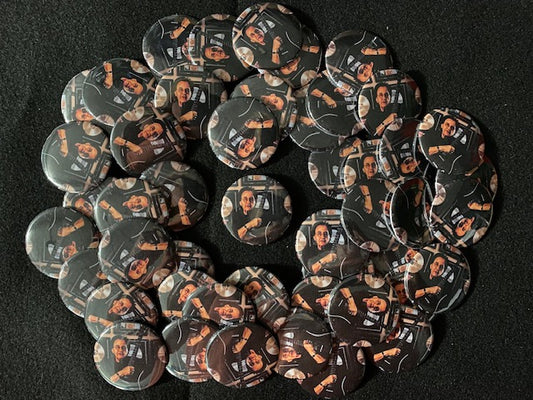 John Regan memorial buttons made by Valerie Nadalini for fan giveaway at the 2023 NAMM show we attended